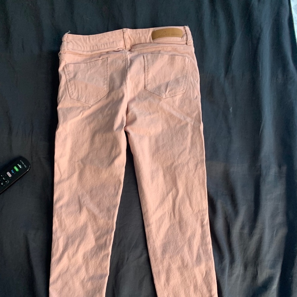 Salmon pink . Skinny jeans
